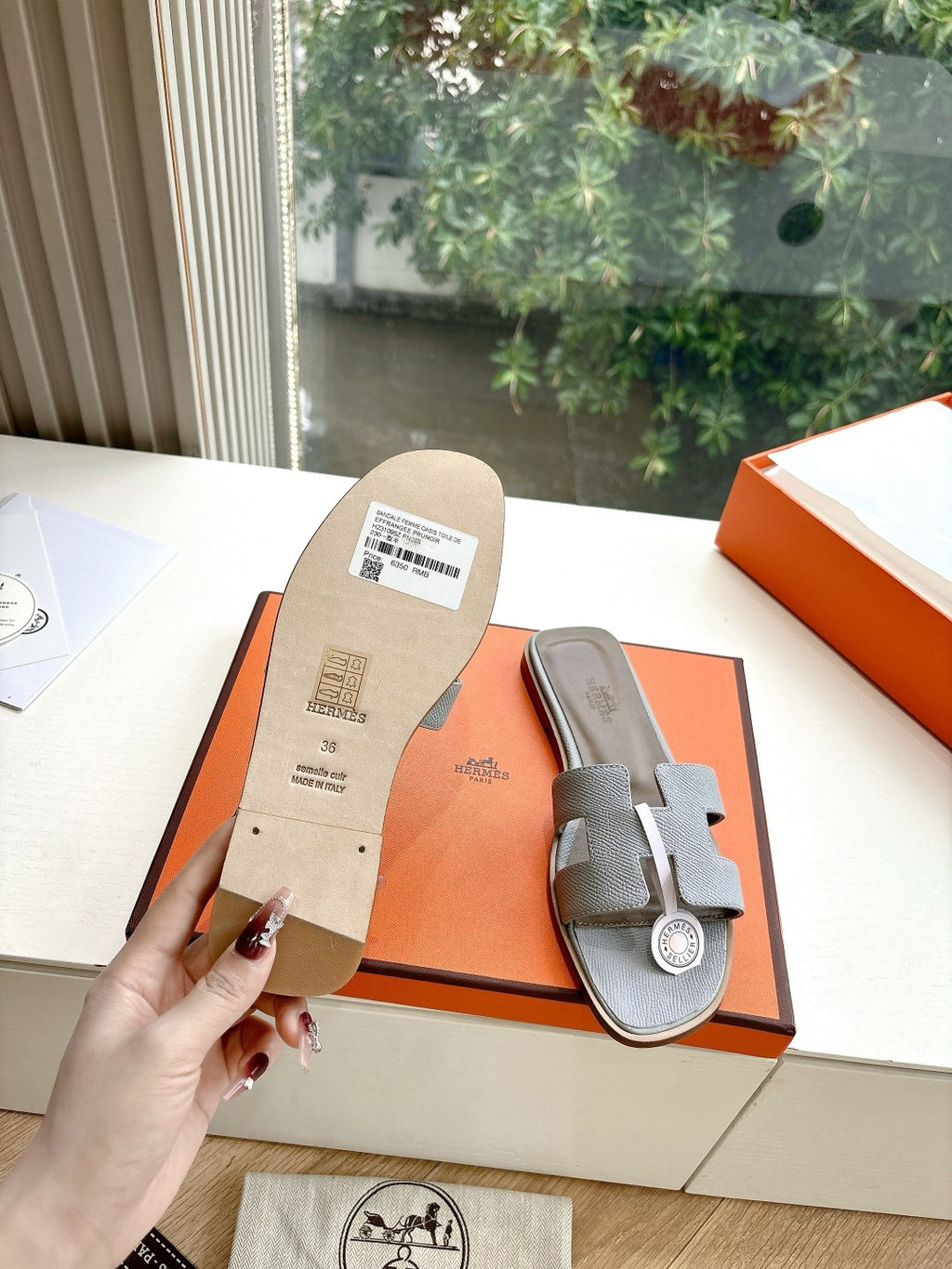 Hermes slide sandal, light gray textured leather with printed size label on sole