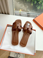 Hermes women's brown leather slide sandals, two strap design, open toe
