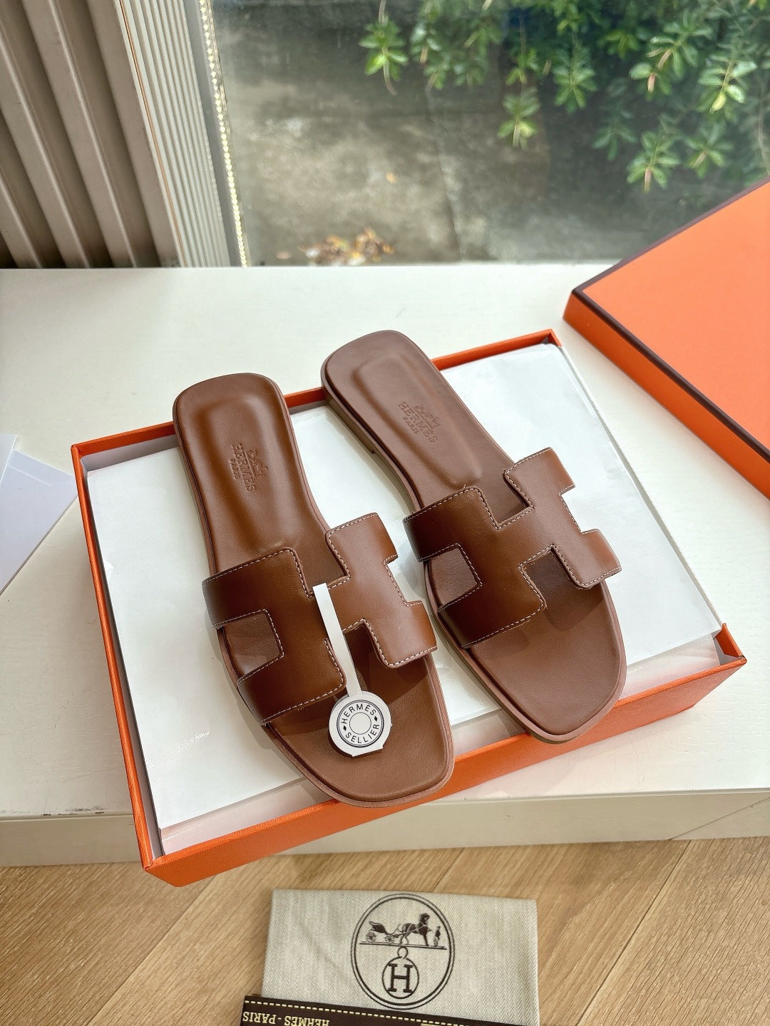 Hermes women's brown leather slide sandals, two wide straps, logo emblem