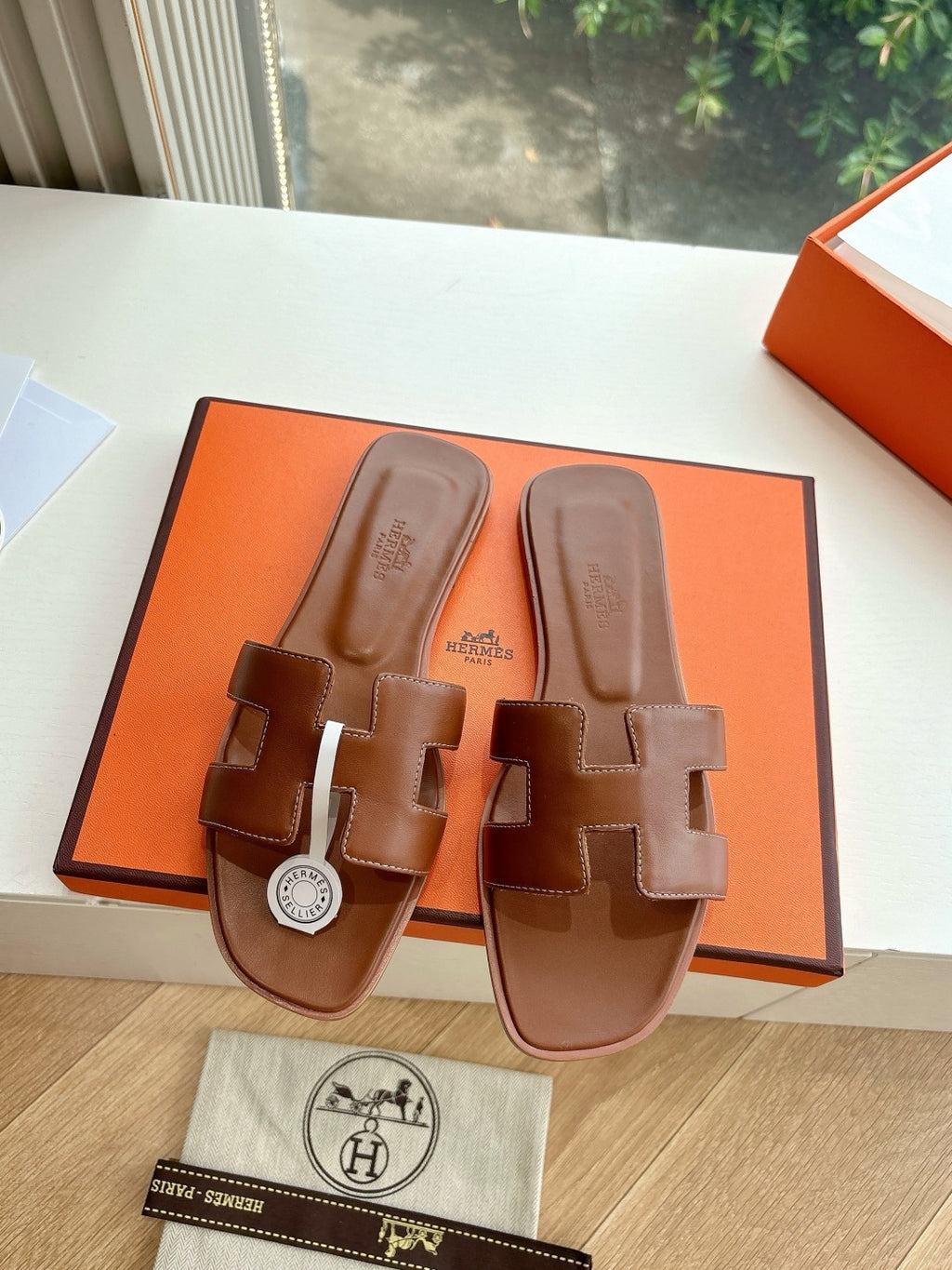 Hermes women's brown leather slide sandals with toe bridge, stacked straps