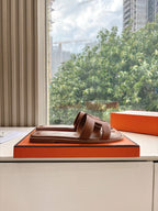 Hermes leather slide sandal on box, brown with two-bar strap