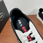 Prada unisex sneakers inside collar, dark lining with “PRADA” detail near laces