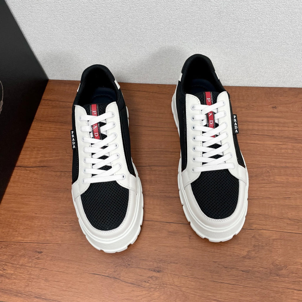 Prada unisex sneakers front view, white uppers with black toe/side mesh, lace-up