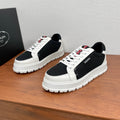 Prada unisex sneakers, white leather with black mesh panels, lace-up, chunky sole
