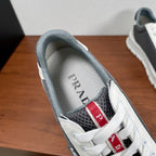 Prada unisex sneakers inner collar view: gray lining, PRADA insole, lace eyelets