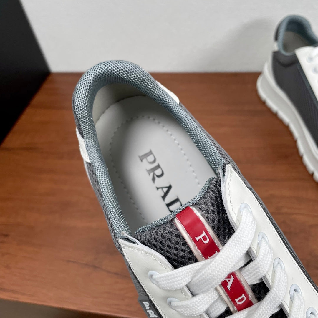 Prada unisex sneakers inner collar view: gray lining, PRADA insole, lace eyelets