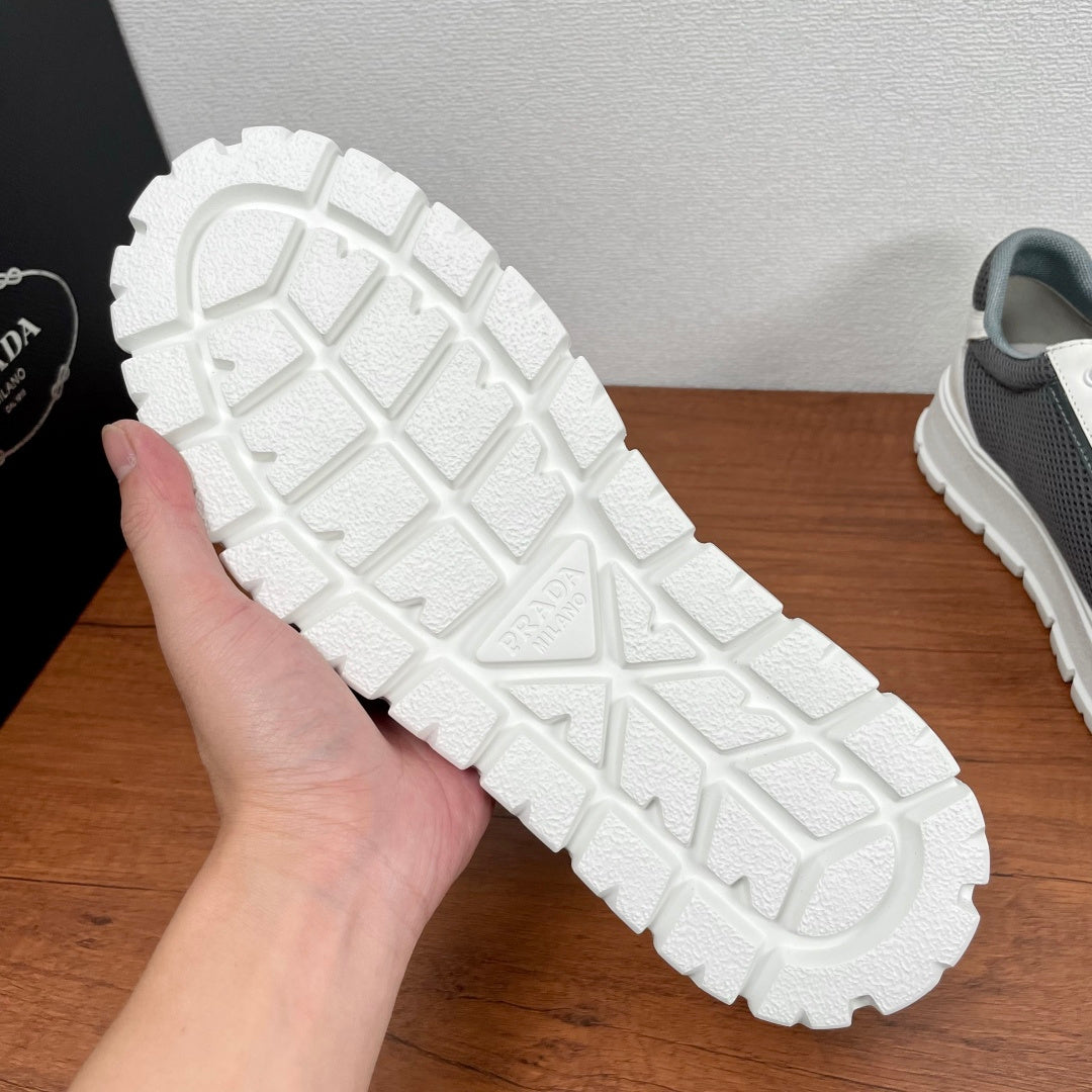 Prada unisex sneaker outsole: textured white tread with PRADA logo, chunky profile