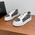 Prada unisex sneakers with white leather toe and gray perforated mesh, red logo tab