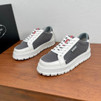 Prada unisex sneakers with white leather toe and gray perforated mesh, red logo tab