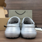 Back view of silver clogs with heel strap and vented toe openings