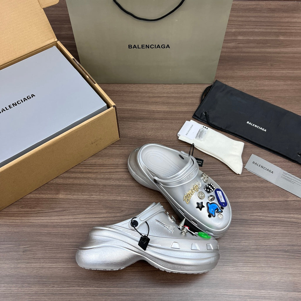 Silver clogs with charm-decorated uppers and molded midsole