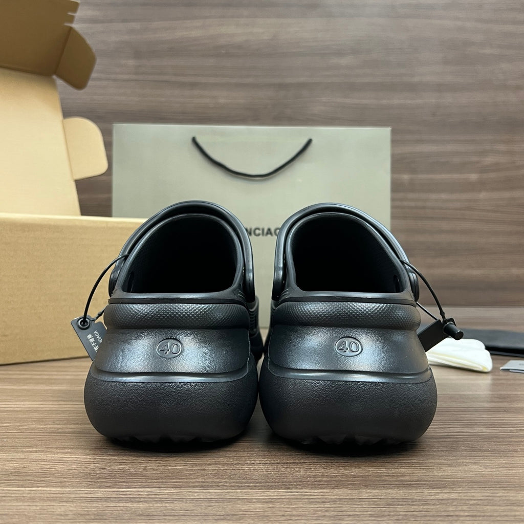 Black Balenciaga sandals back view with adjustable strap openings and cushioned heel