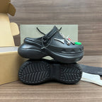 Black Balenciaga sandals with lace strap and textured outsole, side and bottom view