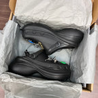 Black Balenciaga sandals in box with lace straps and decorative charm accents