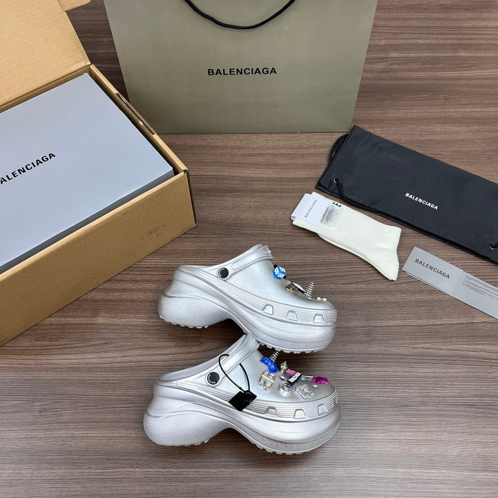 Balenciaga silver platform clogs, open side and top view, with charm accents