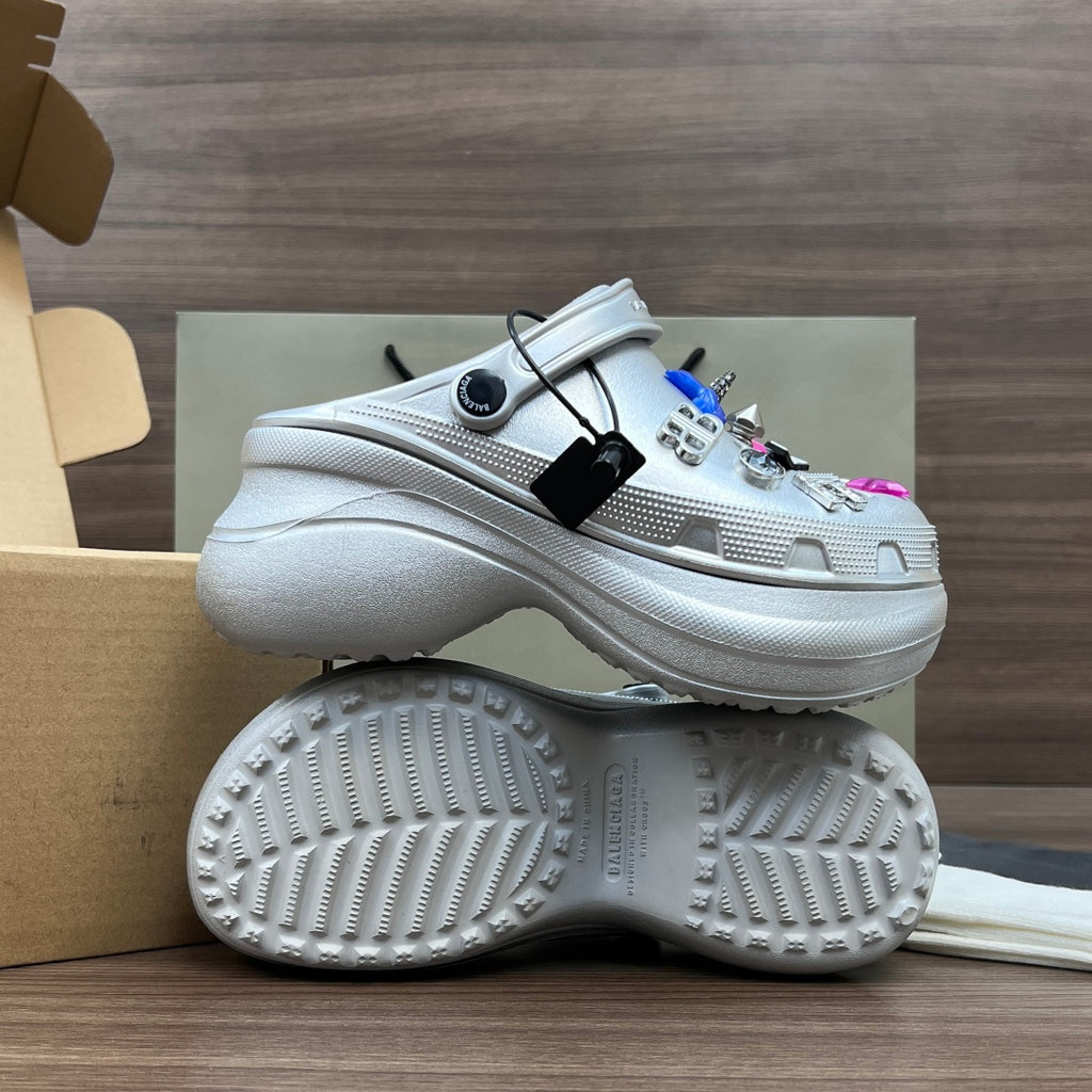 Balenciaga silver platform clogs, outsole and side view, with decorative charms