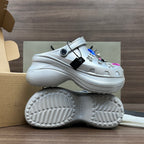 Balenciaga silver platform clogs, outsole and side view, with decorative charms