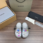 Balenciaga silver platform clogs with colorful charms and buckled straps