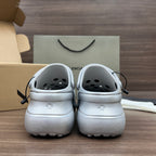 Balenciaga silver platform clogs, back view, black laces and vented heel holes