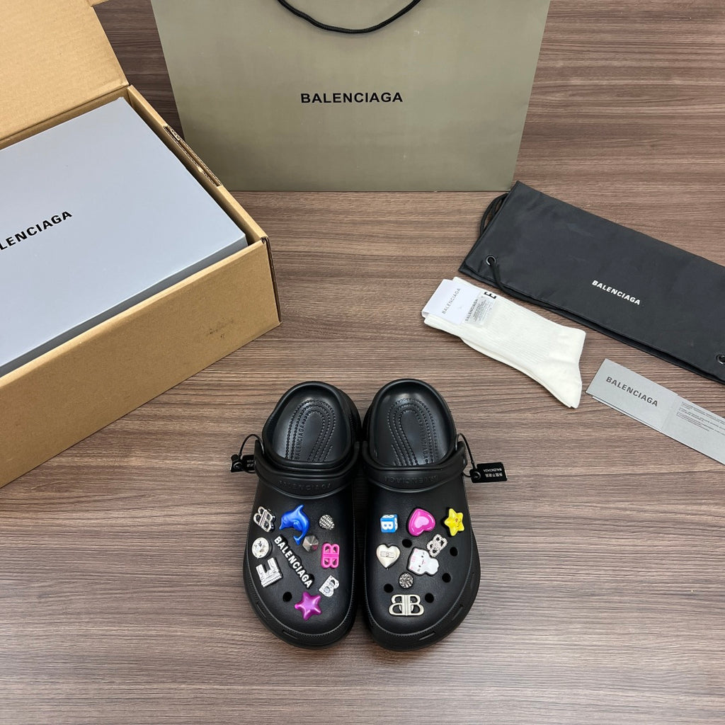 Black Balenciaga sandal clogs with colorful charm decorations on the front straps