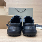 Black Balenciaga clogs, rear view with size 36 stamp and pull tabs