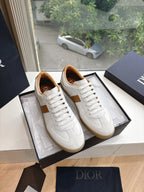 White and tan unisex sneakers, lace-up with smooth leather upper