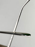 Sunglasses arm close-up with “ITALY” and part numbers printed on the metal