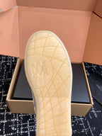White rubber outsole with textured grid pattern and AMIRI logo