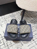 Dior slide sandals with beige Dior Oblique-print strap and black contoured sole
