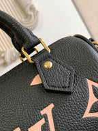 Louis Vuitton black textured leather bag with gold D-ring and star-shaped charm