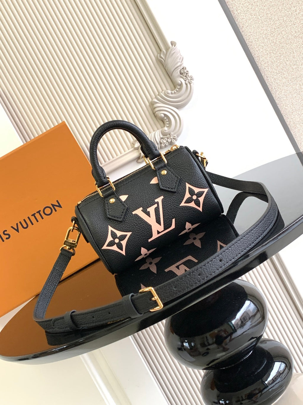 Louis Vuitton black monogram top-handle bag with adjustable shoulder strap