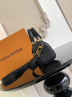 Louis Vuitton black leather mini bag with gold clasp and crossbody strap