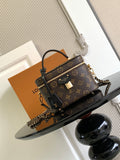 Louis Vuitton monogram mini bag with top handle and chain strap, gold zipper hardware.