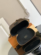 Louis Vuitton monogram mini bag open, showing black interior lining and top zipper closure.