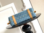 Louis Vuitton monogram tote bag with blue canvas flap and tan leather straps
