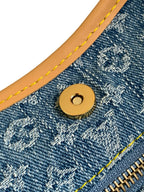 Louis Vuitton monogram canvas snap button with tan stitching and gold hardware