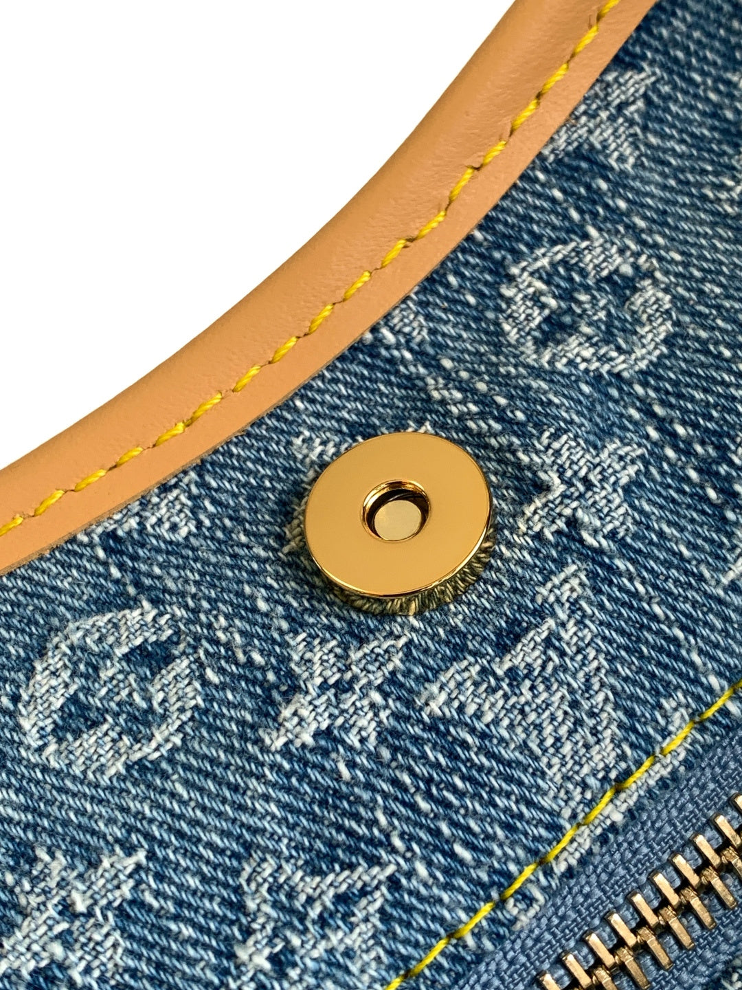 Louis Vuitton monogram canvas snap button with tan stitching and gold hardware