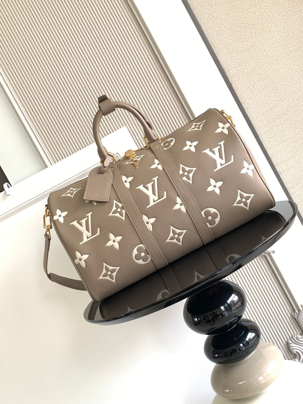 Louis Vuitton bag in taupe with monogram pattern, top handles and shoulder strap