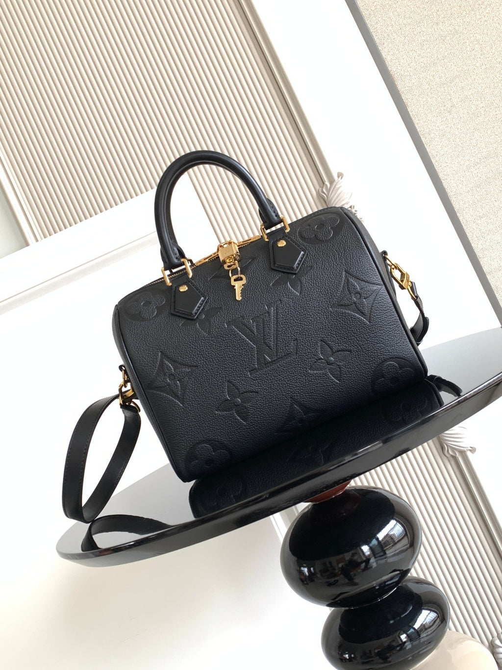 Louis Vuitton monogram handbag in dark navy/black with top handles and shoulder strap