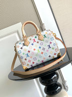 Louis Vuitton monogram handbag with multicolor allover pattern and tan strap