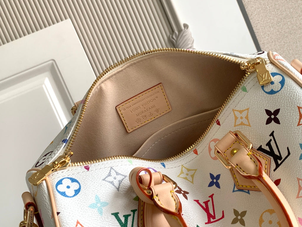 Louis Vuitton monogram handbag open top with beige interior lining and gold zipper