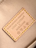 Louis Vuitton handbag leather interior label with embossed text and stitching