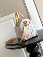 Louis Vuitton monogram handbag in multicolor print with tan leather handles