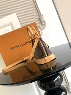 Louis Vuitton monogram mini handbag with crossbody strap and front zipper