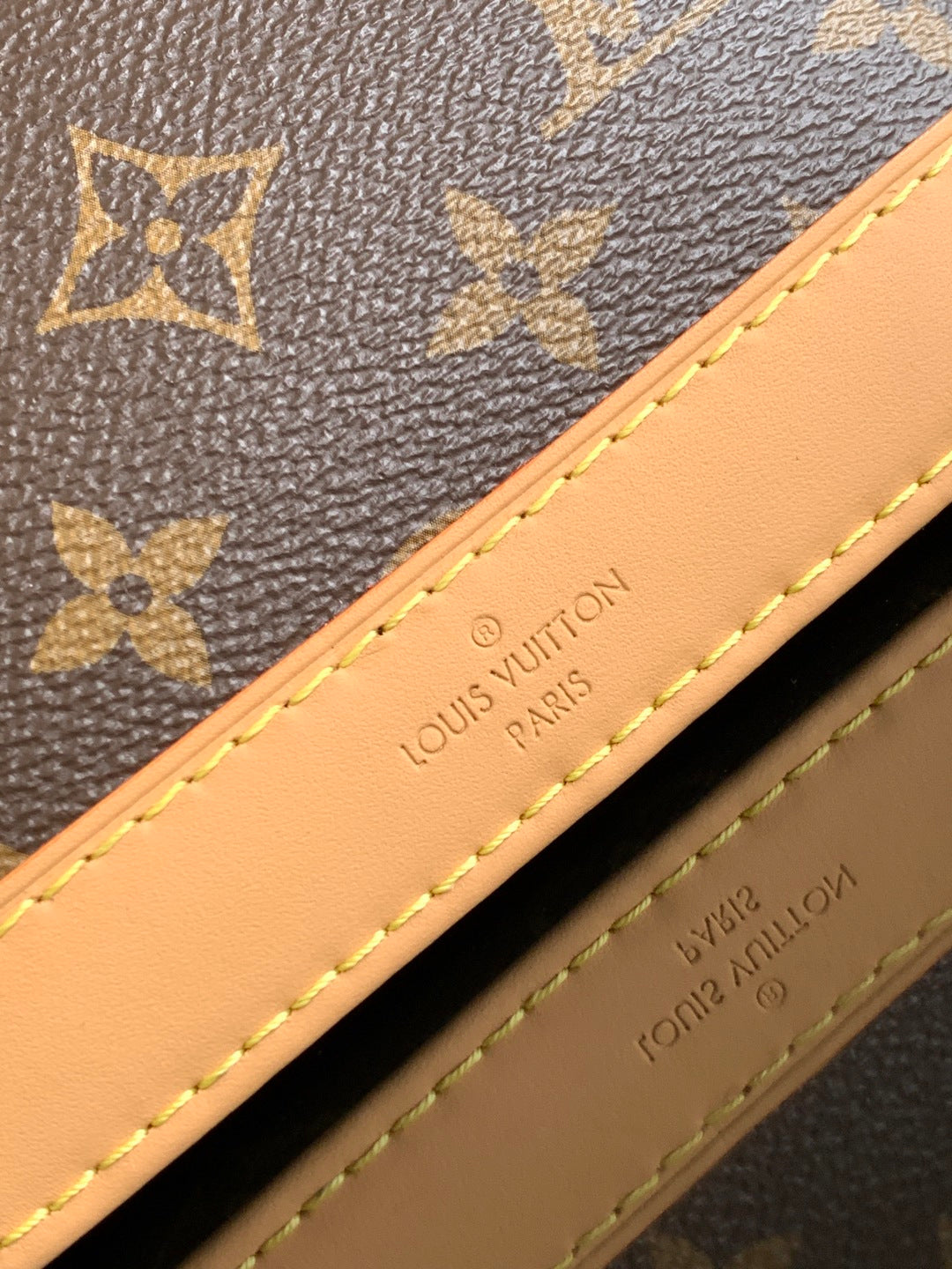 Louis Vuitton monogram bag with Louis Vuitton Paris label on tan leather trim