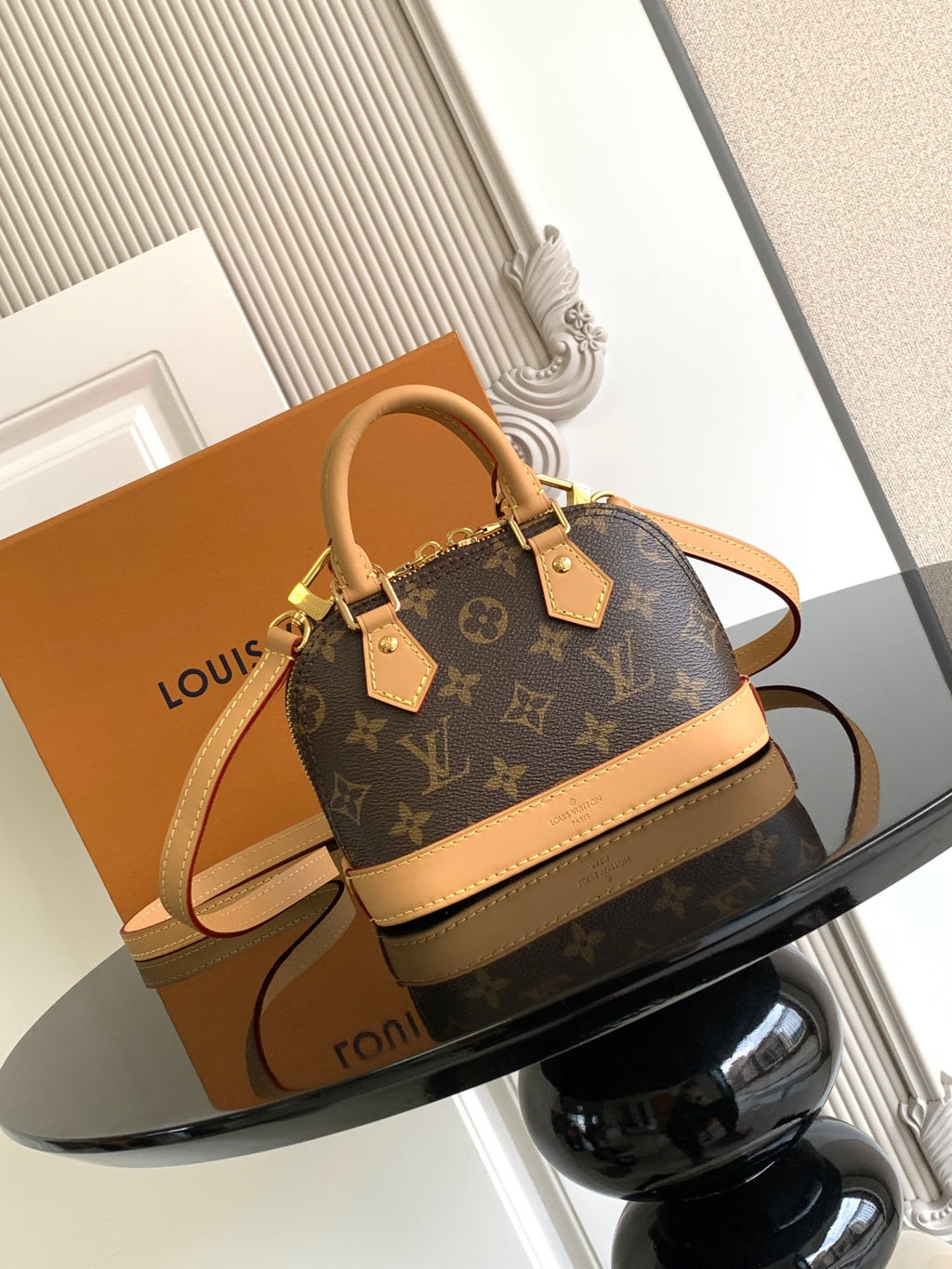 Louis Vuitton monogram mini handbag with tan trim and top handle