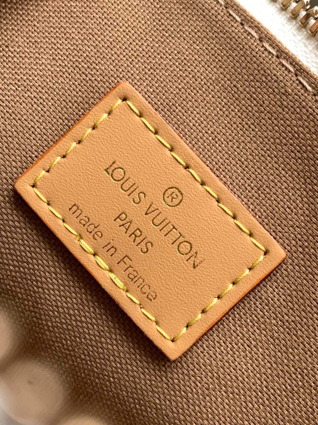 Louis Vuitton Paris leather tag reading “Made in France”