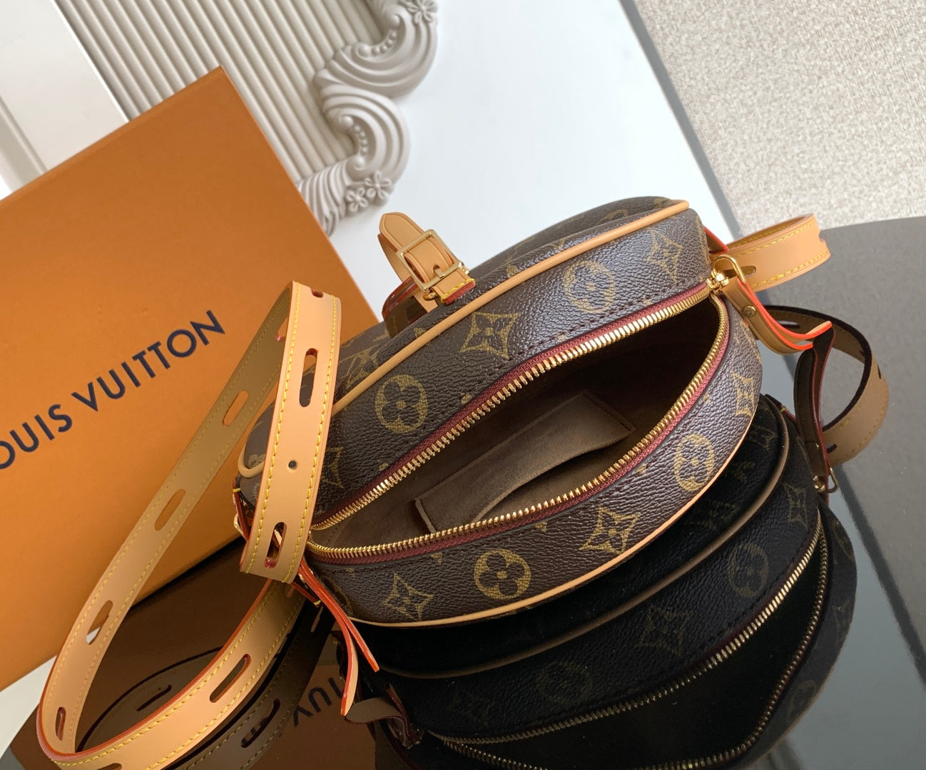 Louis Vuitton monogram crossbody bag with open top and tan zipper trim