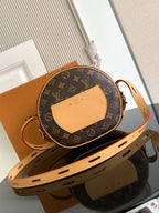 Louis Vuitton monogram crossbody bag with tan flap detail and top zipper