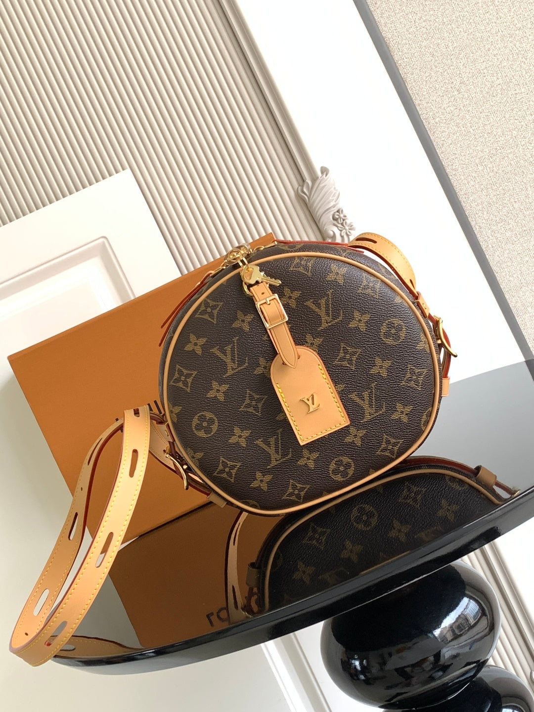 Louis Vuitton monogram round crossbody bag with tan leather trim